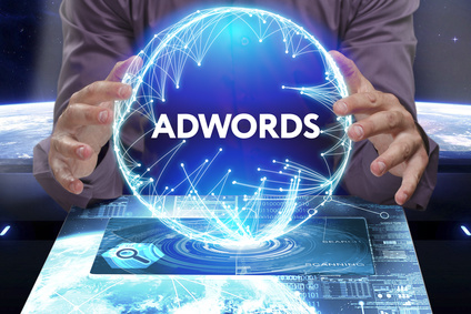 Business, Technology, Internet and network concept. Young businessman shows the word on the virtual display of the future: AdWords